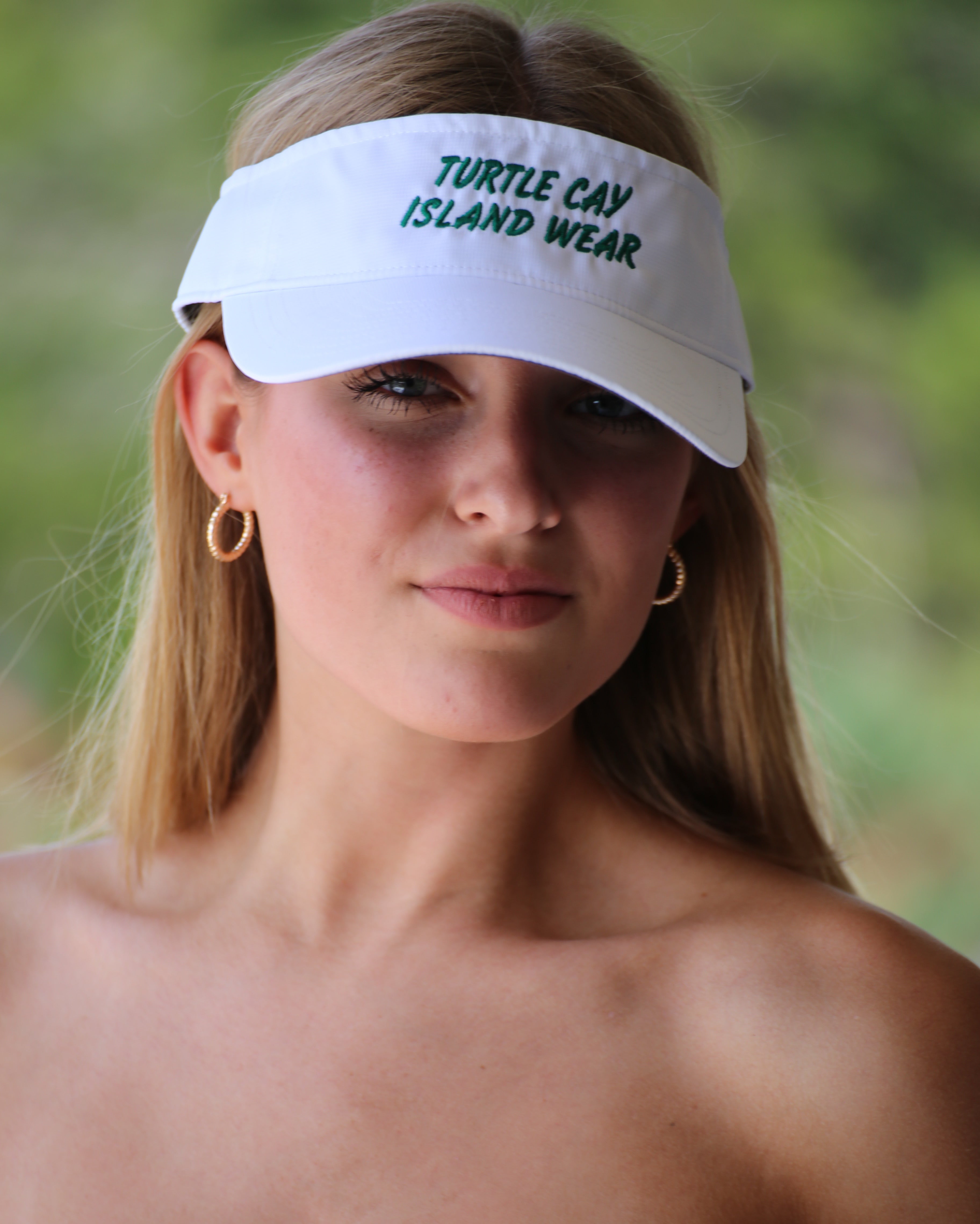 White Visor, Embroidered in Green Logo Name